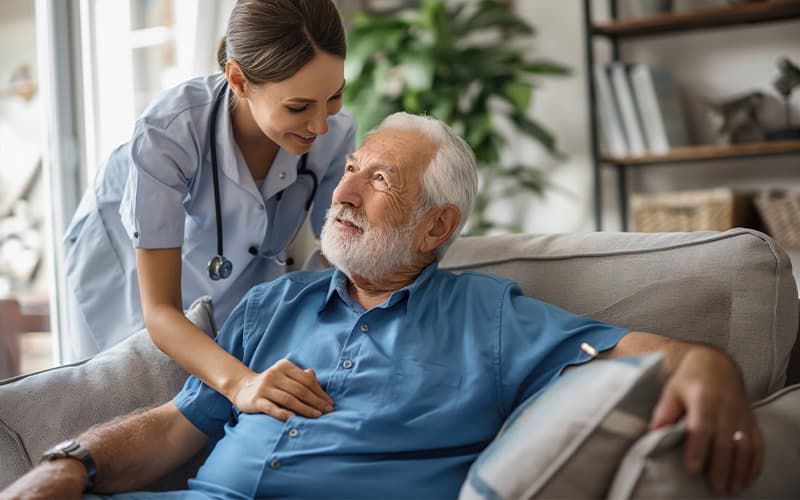 Nurse caring for elderly patient
